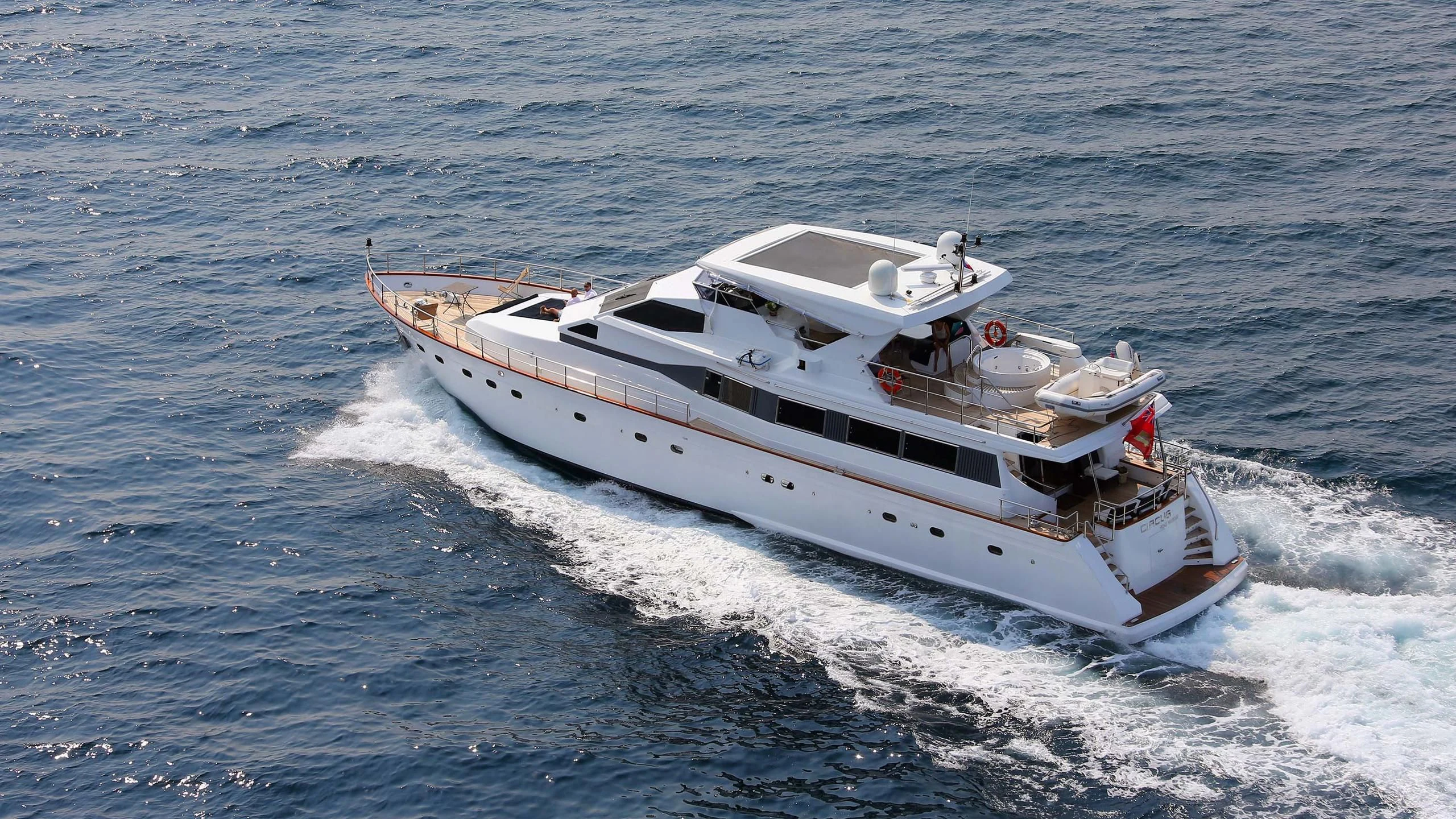 a white boat on the water aboard CIRCUS Yacht for Sale