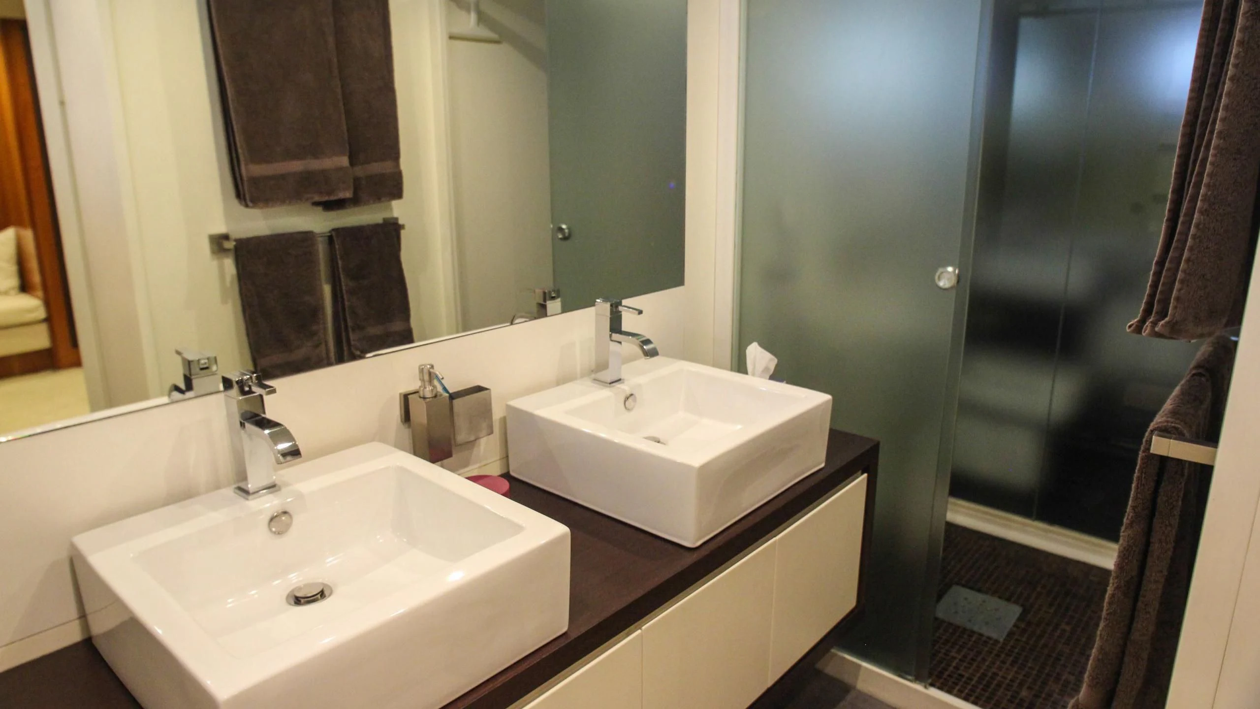 a bathroom with two sinks aboard CIRCUS Yacht for Sale