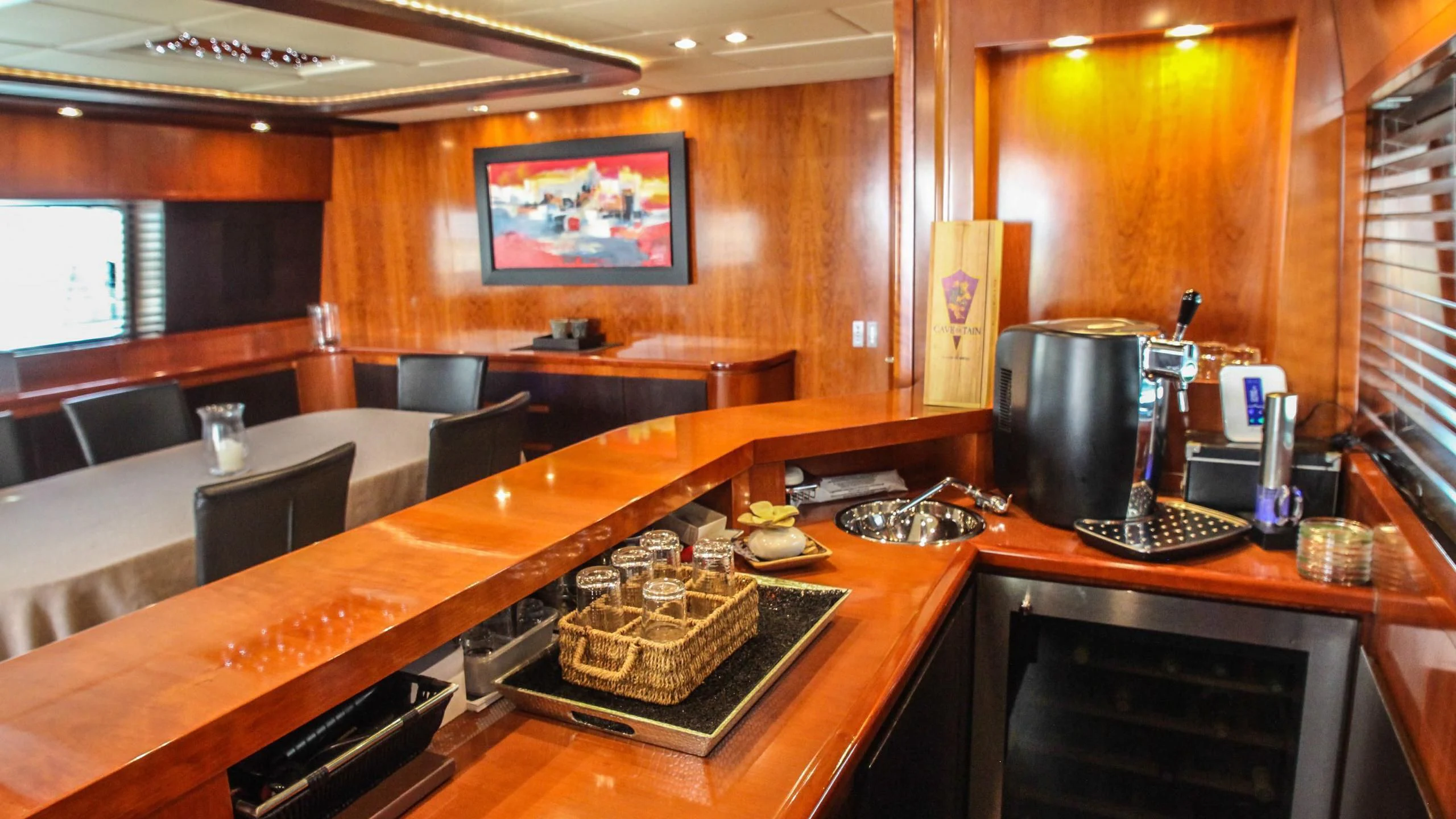 a kitchen with a table and chairs aboard CIRCUS Yacht for Sale