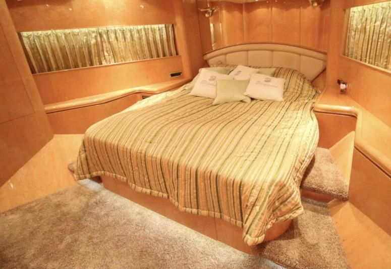 a bed in a room aboard JOYS Yacht for Sale
