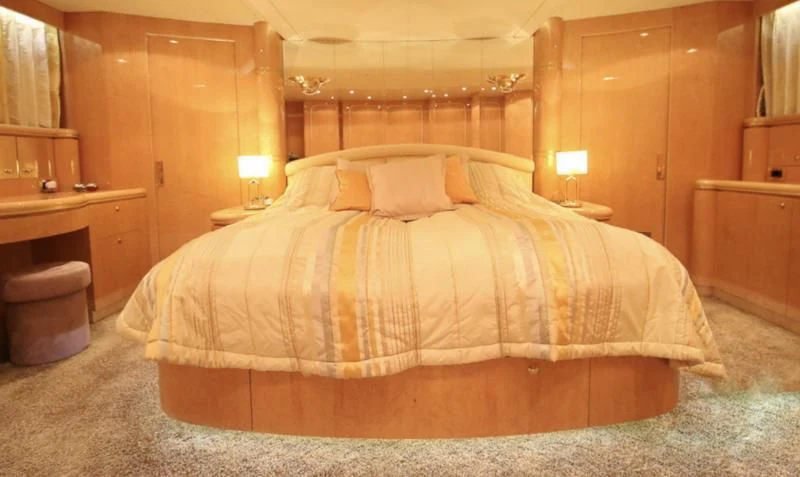 a bed in a room aboard JOYS Yacht for Sale