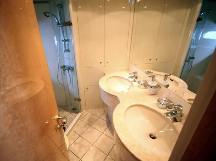 a bathroom with a sink and a shower aboard JOYS Yacht for Sale