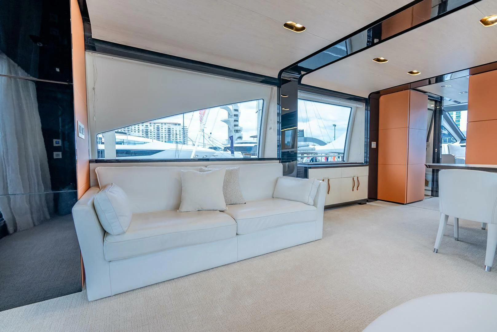 a living room with a large window aboard 80 AZIMUT Yacht for Sale