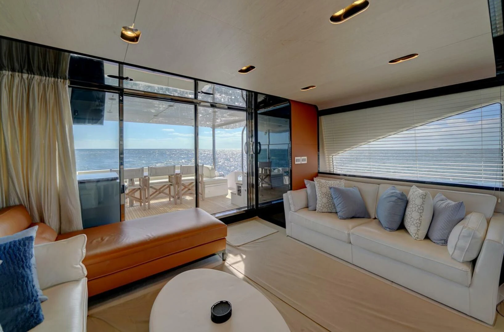 a living room with a large glass window aboard 80 AZIMUT Yacht for Sale
