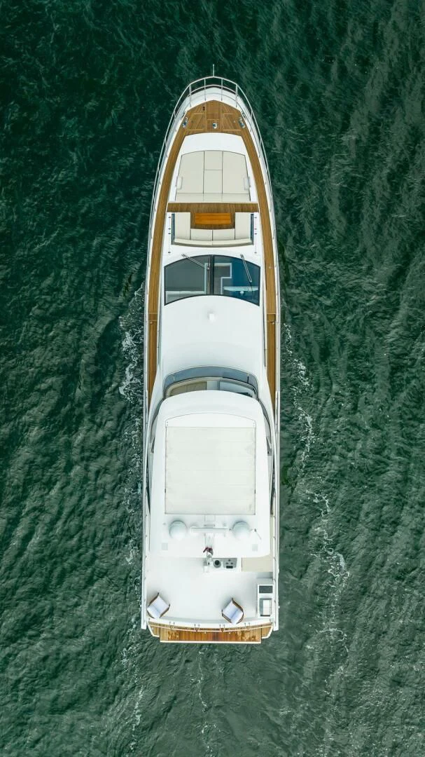 a white and yellow boat on a body of water aboard 80 AZIMUT Yacht for Sale