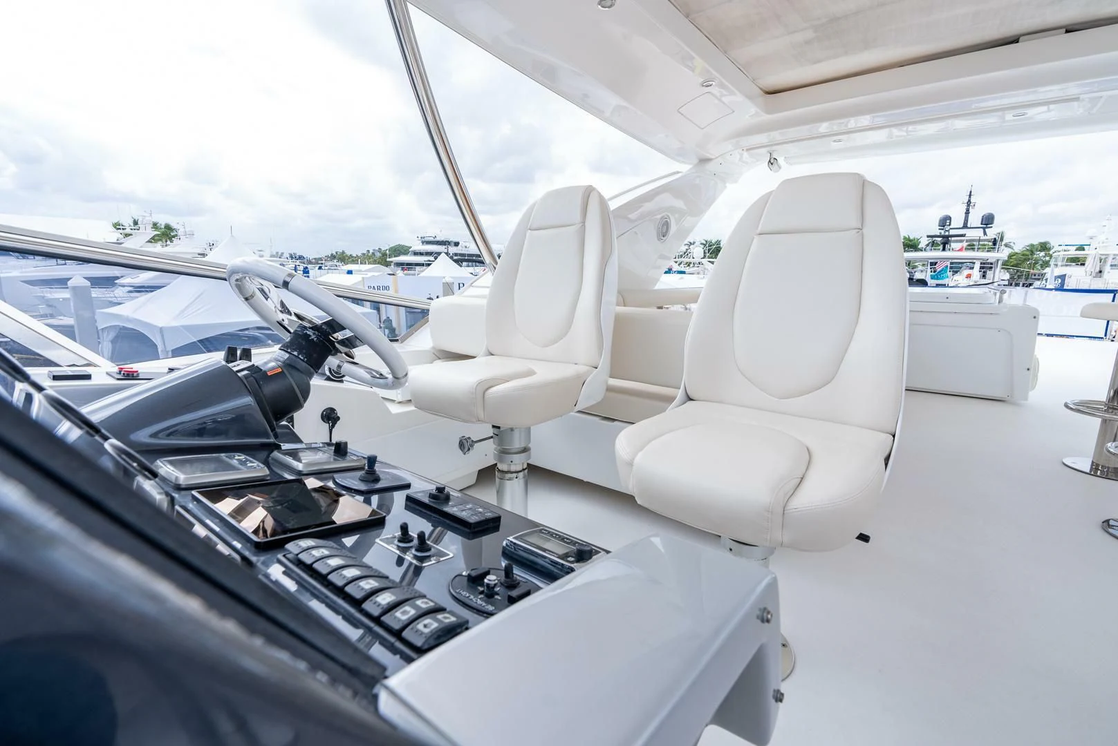 a white car with a white interior aboard 80 AZIMUT Yacht for Sale
