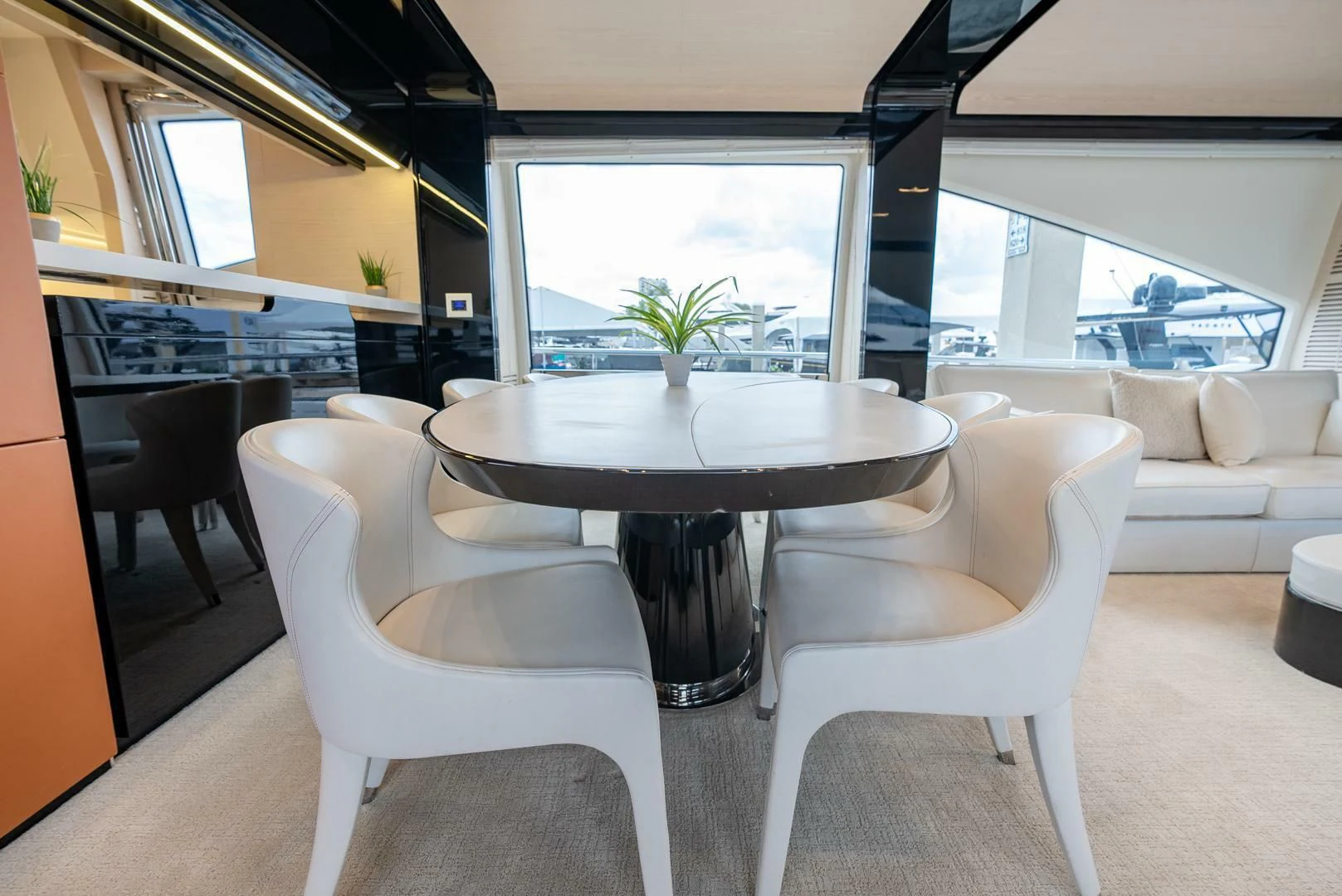 a room with a table and chairs aboard 80 AZIMUT Yacht for Sale