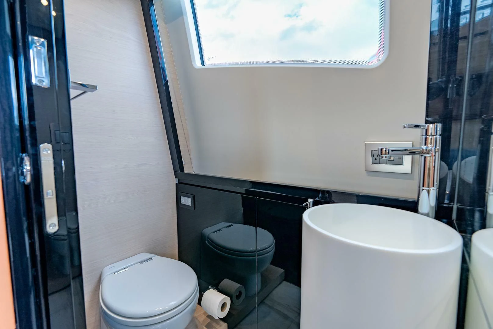 a bathroom with a toilet and a bidet aboard 80 AZIMUT Yacht for Sale