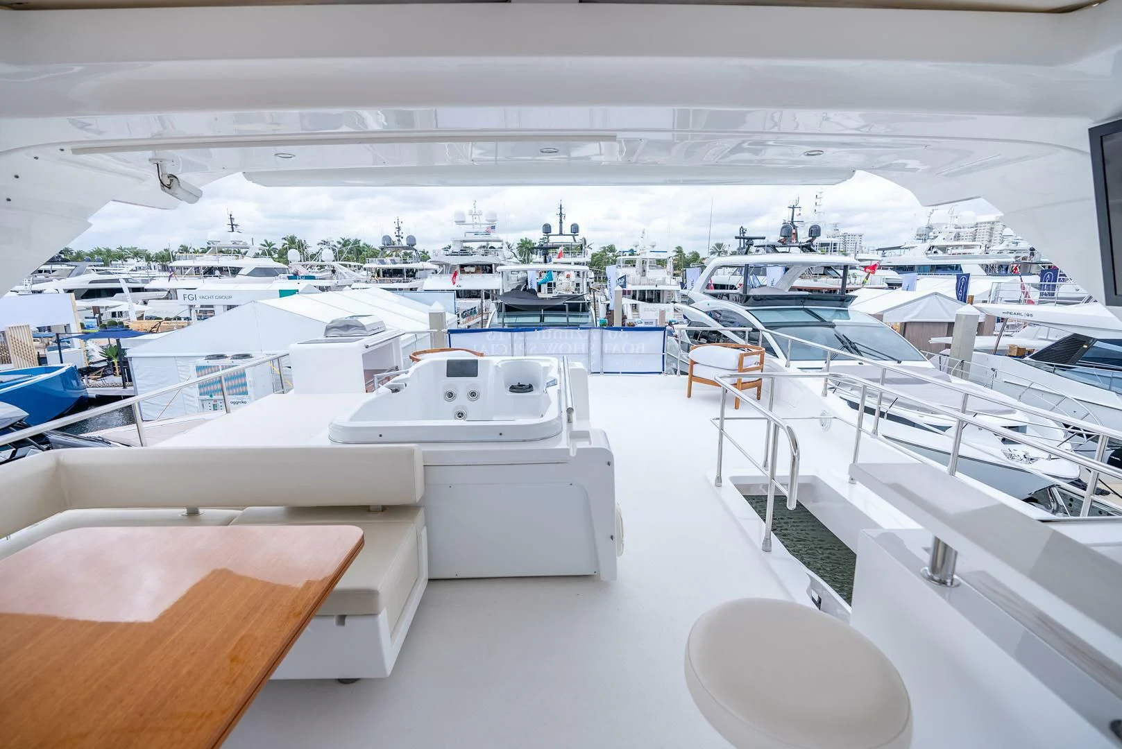 a room with many white tables and chairs aboard 80 AZIMUT Yacht for Sale