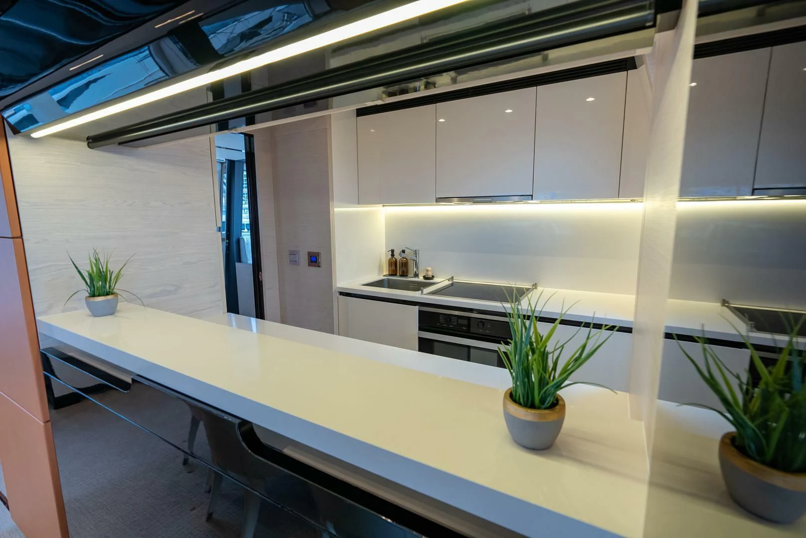 a kitchen with white cabinets aboard 80 AZIMUT Yacht for Sale