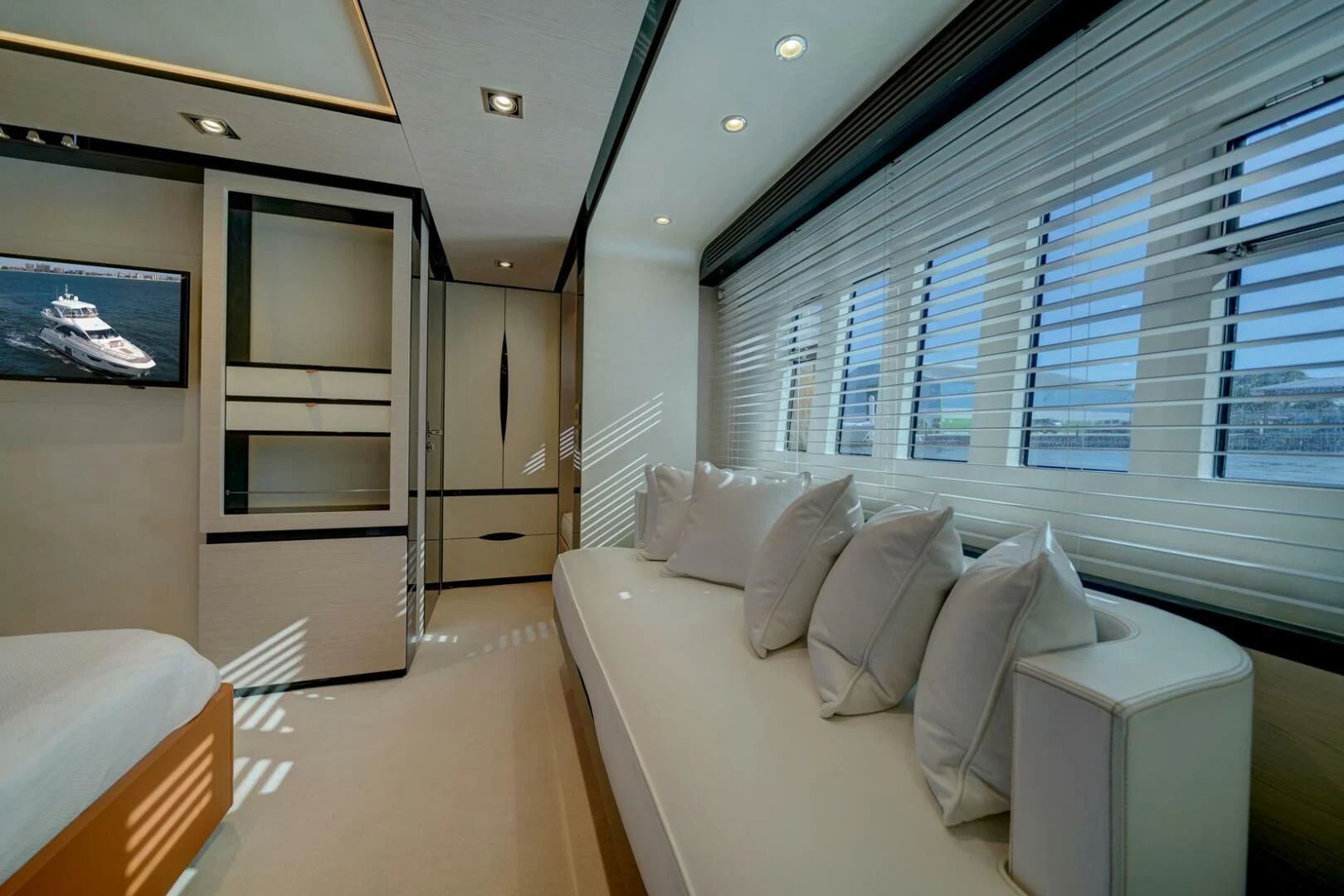 a room with a couch and a television aboard 80 AZIMUT Yacht for Sale