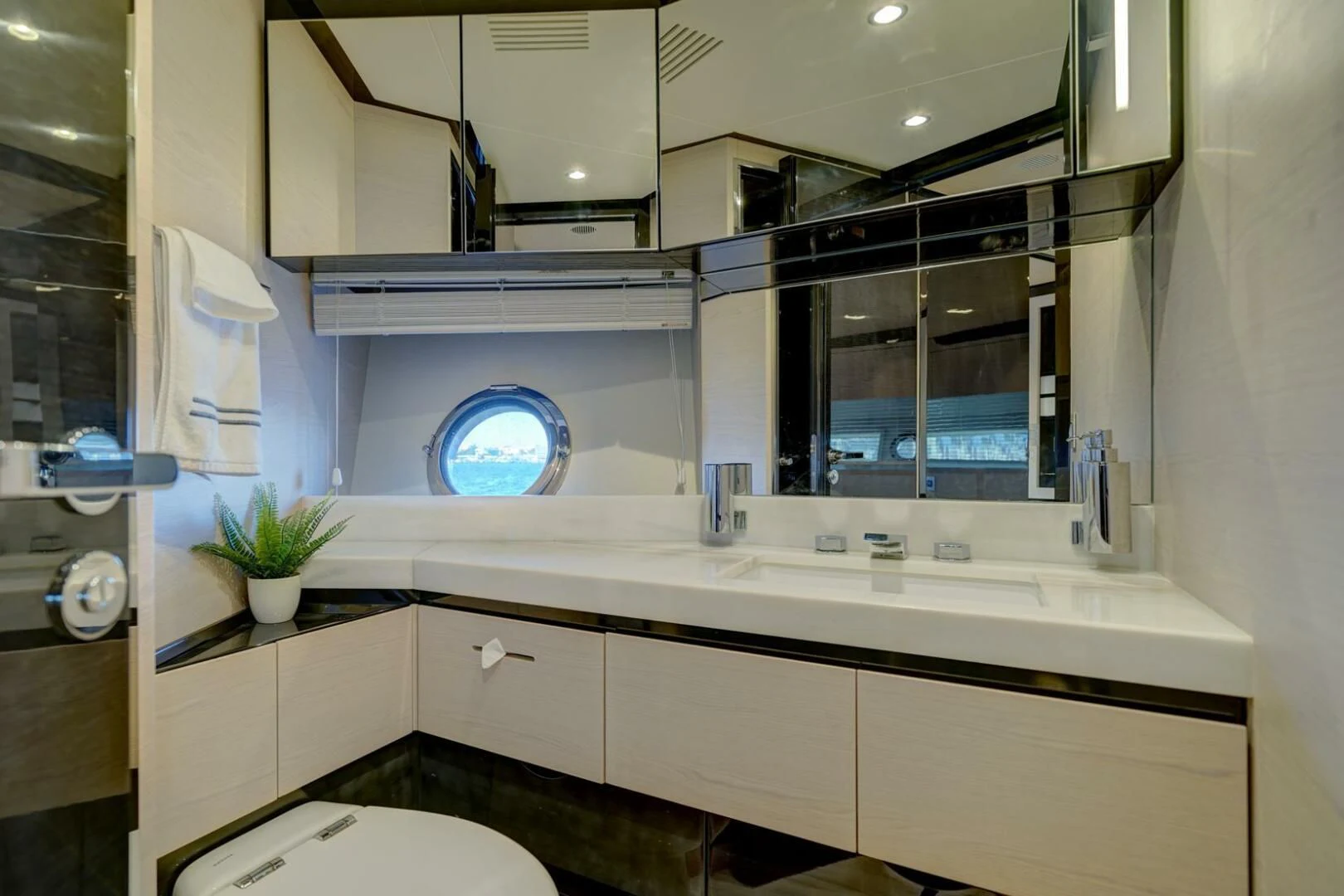 a bathroom with a large mirror aboard 80 AZIMUT Yacht for Sale