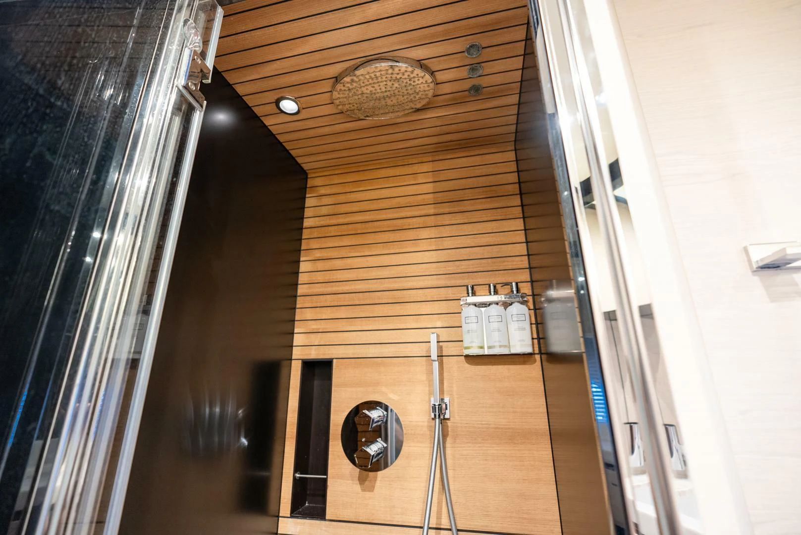 a wooden bathroom with a mirror aboard 80 AZIMUT Yacht for Sale