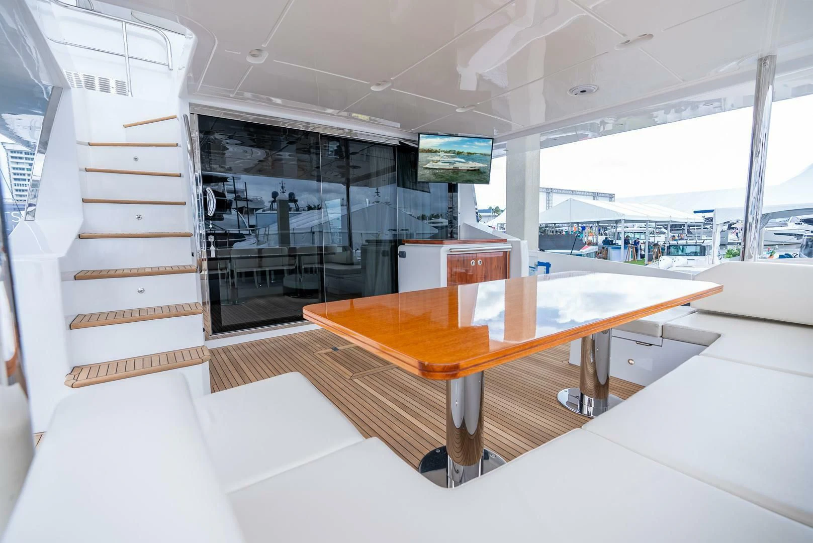 a room with a table and chairs aboard 80 AZIMUT Yacht for Sale