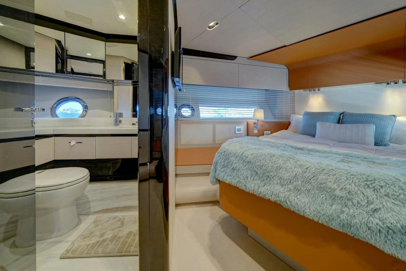 a room with a bed and a mirror aboard 80 AZIMUT Yacht for Sale