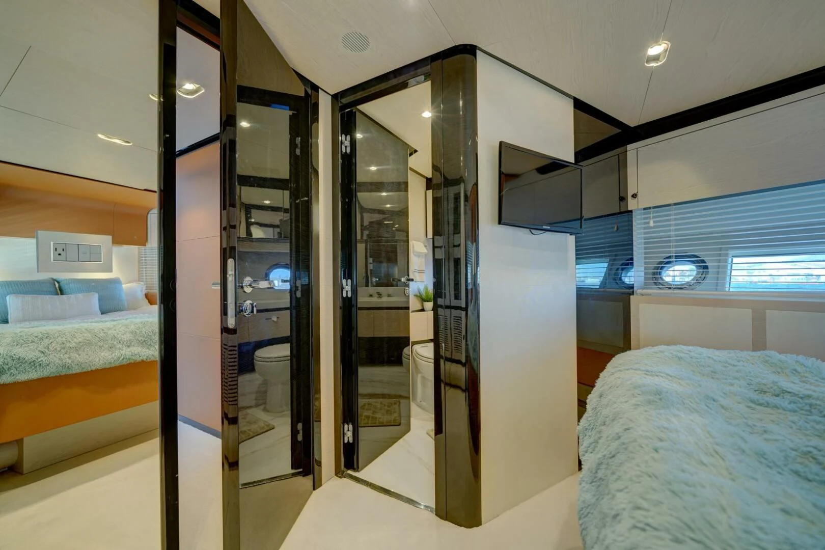 a room with a bed and a closet aboard 80 AZIMUT Yacht for Sale