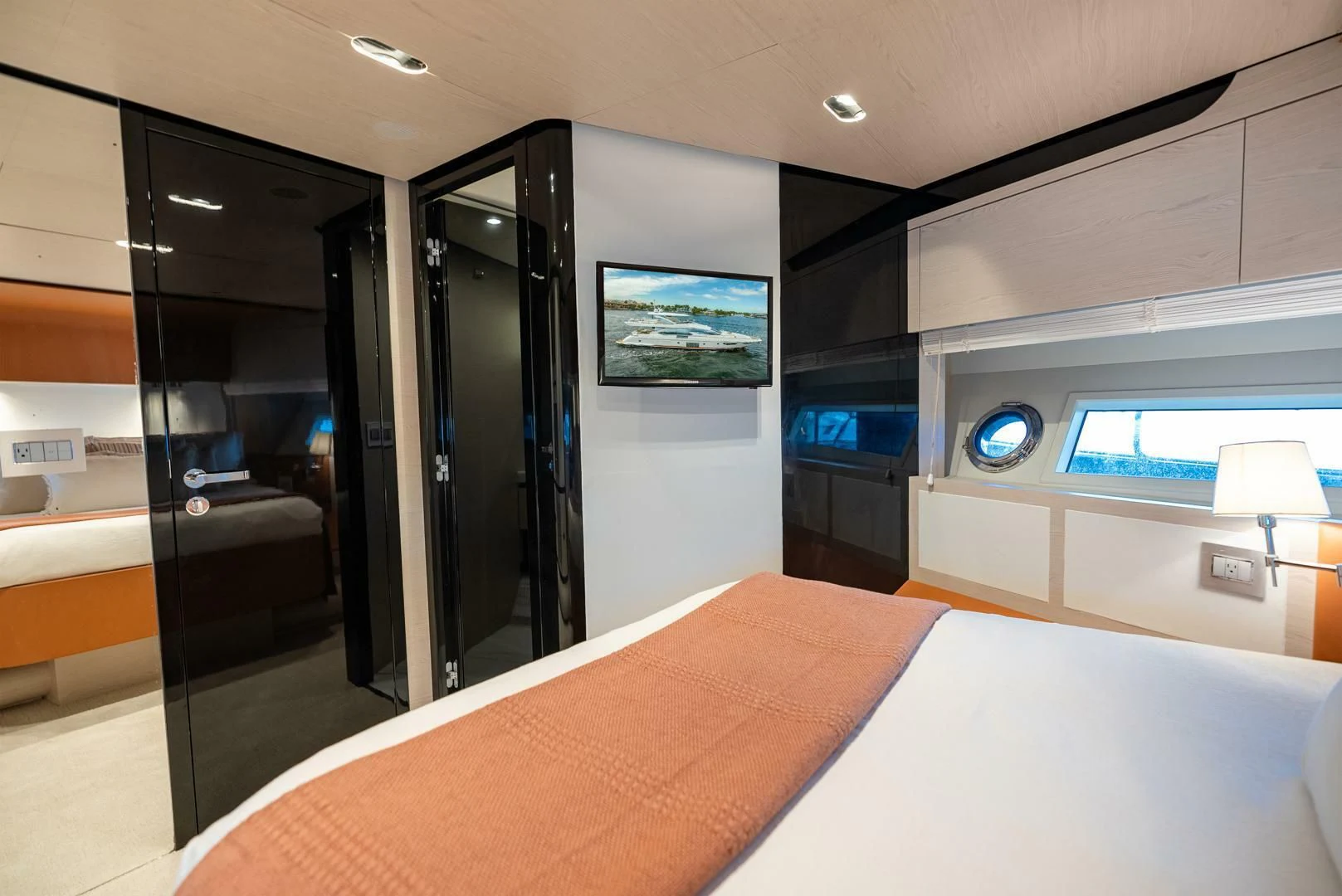 a room with a bed and a desk aboard 80 AZIMUT Yacht for Sale