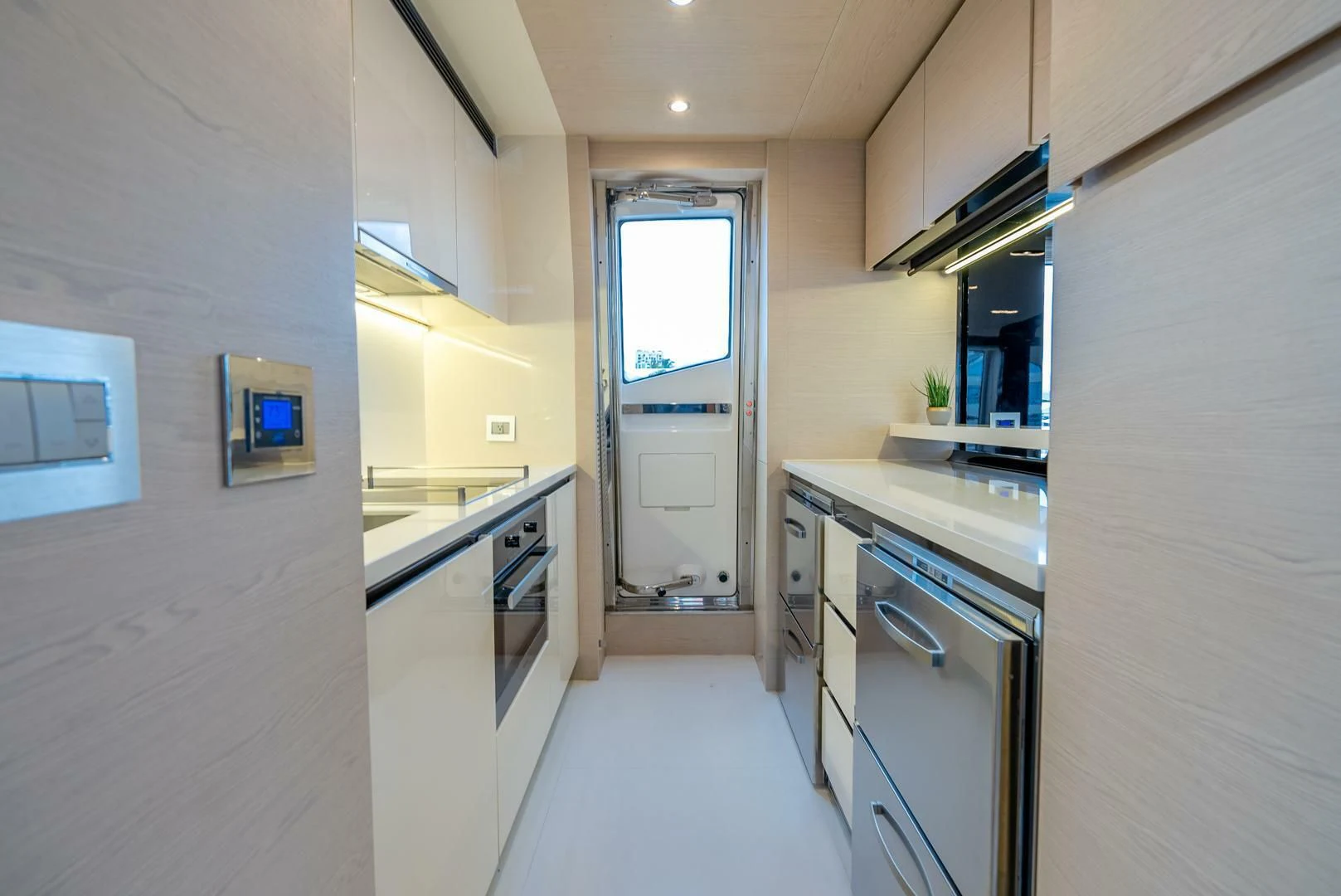 a kitchen with a door and a window aboard 80 AZIMUT Yacht for Sale