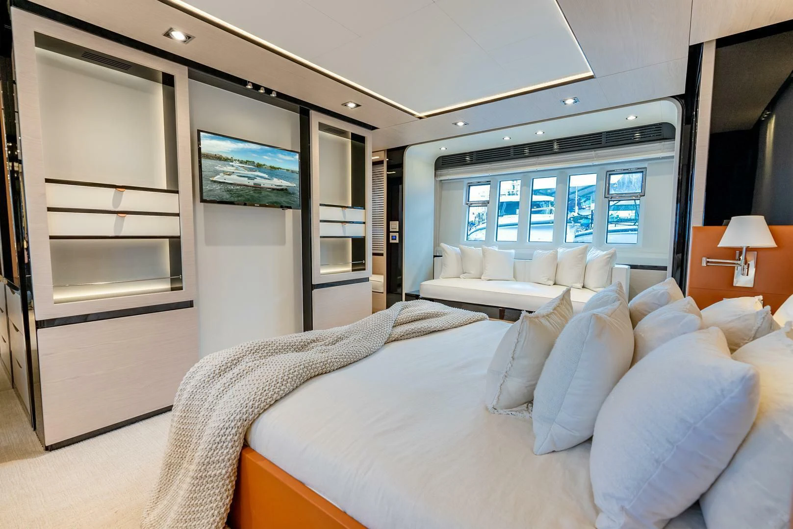 a room with a bed and a tv on the wall aboard 80 AZIMUT Yacht for Sale