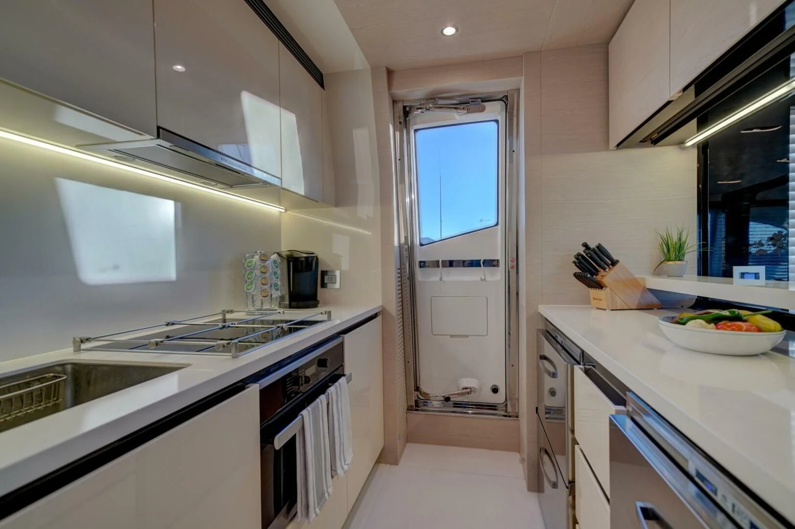 a kitchen with white cabinets aboard 80 AZIMUT Yacht for Sale