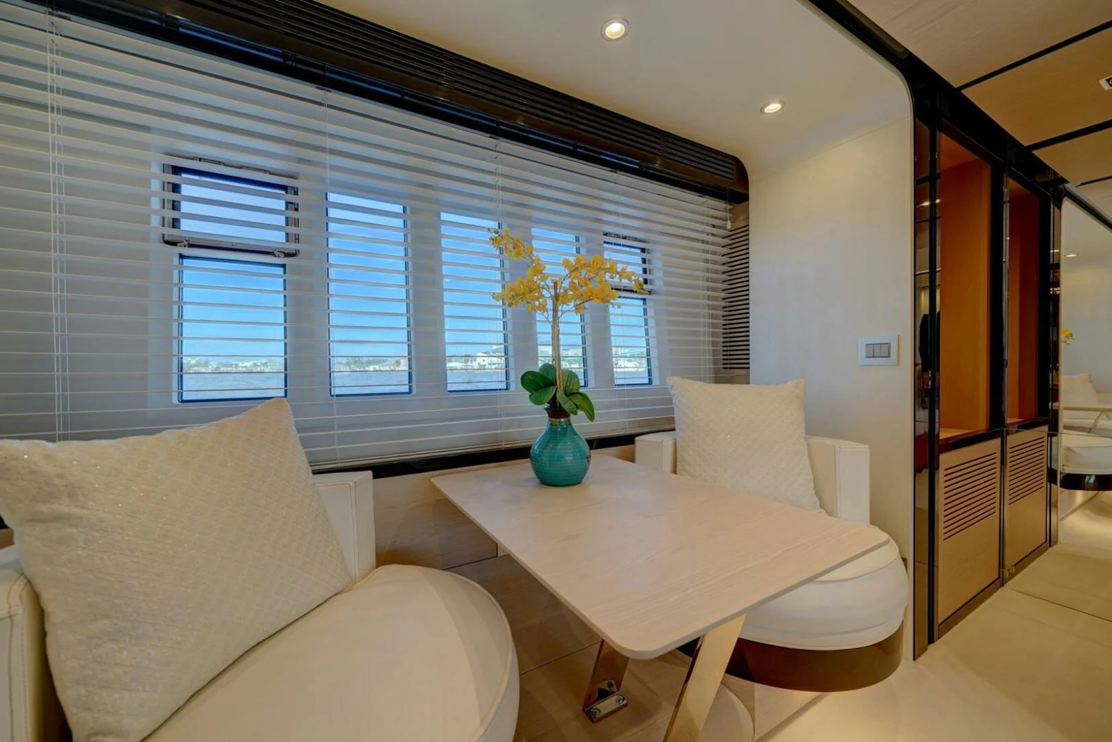 a living room with a table and couches aboard 80 AZIMUT Yacht for Sale