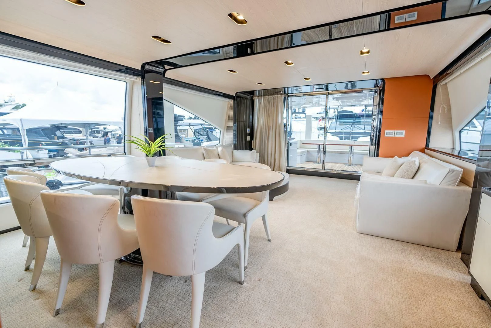 a large room with a table and chairs aboard 80 AZIMUT Yacht for Sale