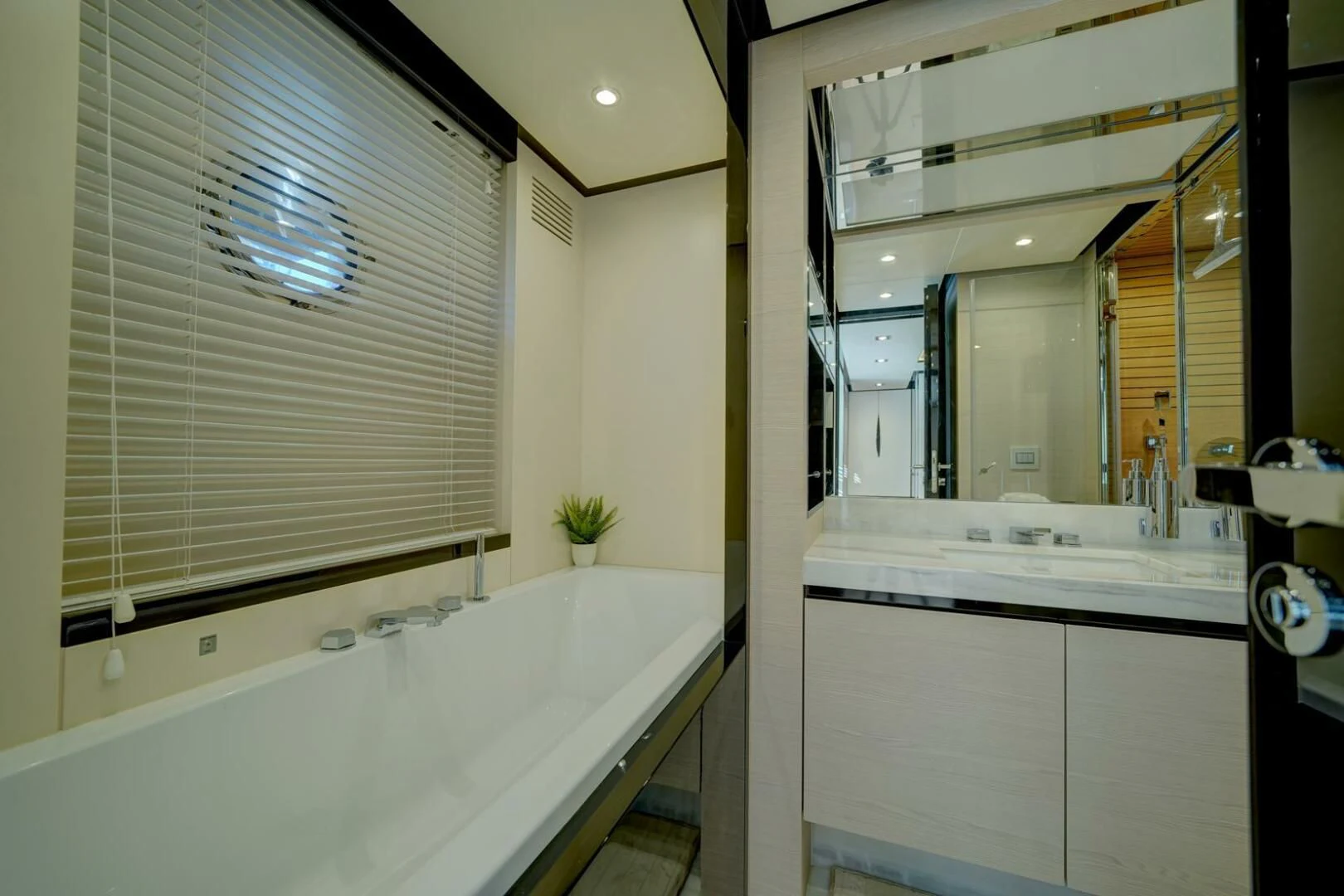 a bathroom with a tub and a sink aboard 80 AZIMUT Yacht for Sale