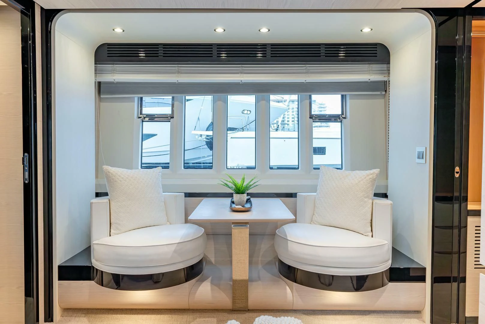 a room with a table and chairs aboard 80 AZIMUT Yacht for Sale