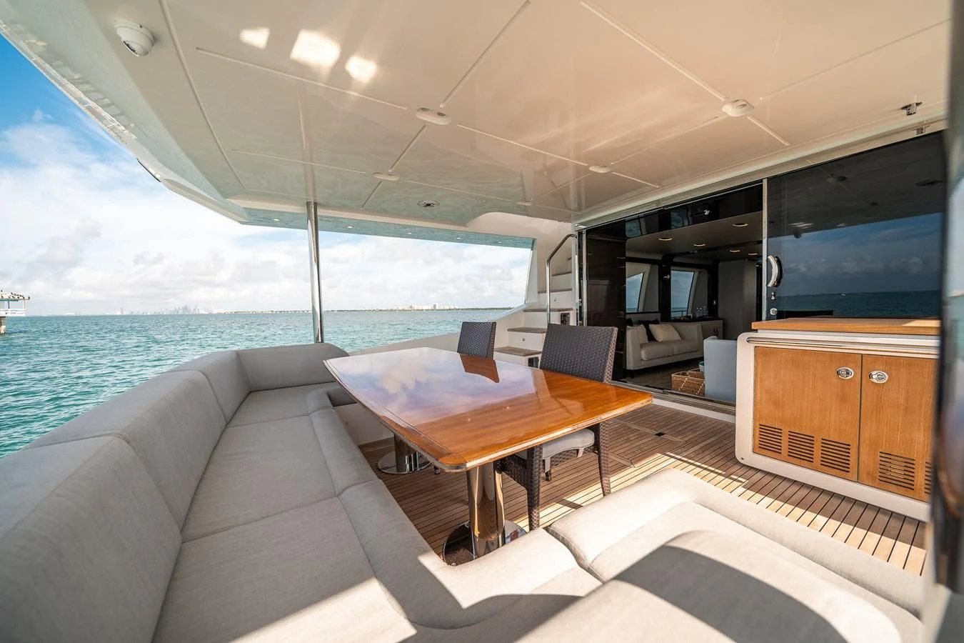 a room with a table and chairs aboard 80 AZIMUT Yacht for Sale