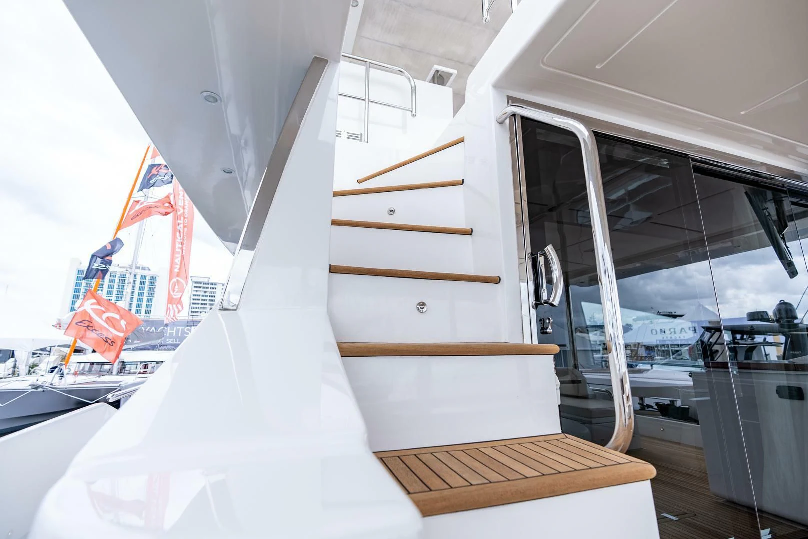 a white boat with a wooden deck aboard 80 AZIMUT Yacht for Sale