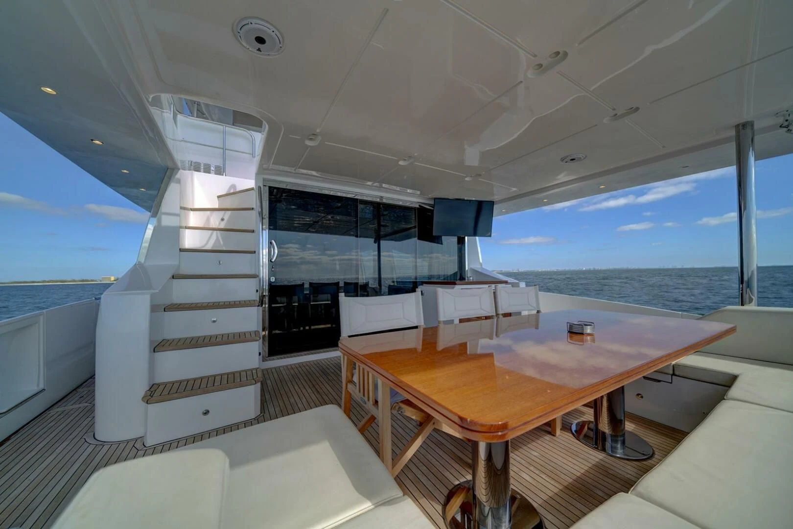 a room with a table and chairs aboard 80 AZIMUT Yacht for Sale
