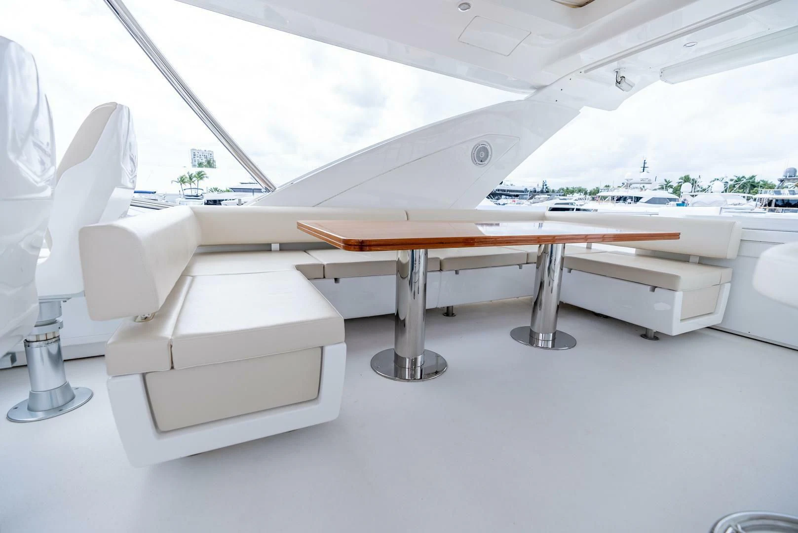 a white chair and a table aboard 80 AZIMUT Yacht for Sale