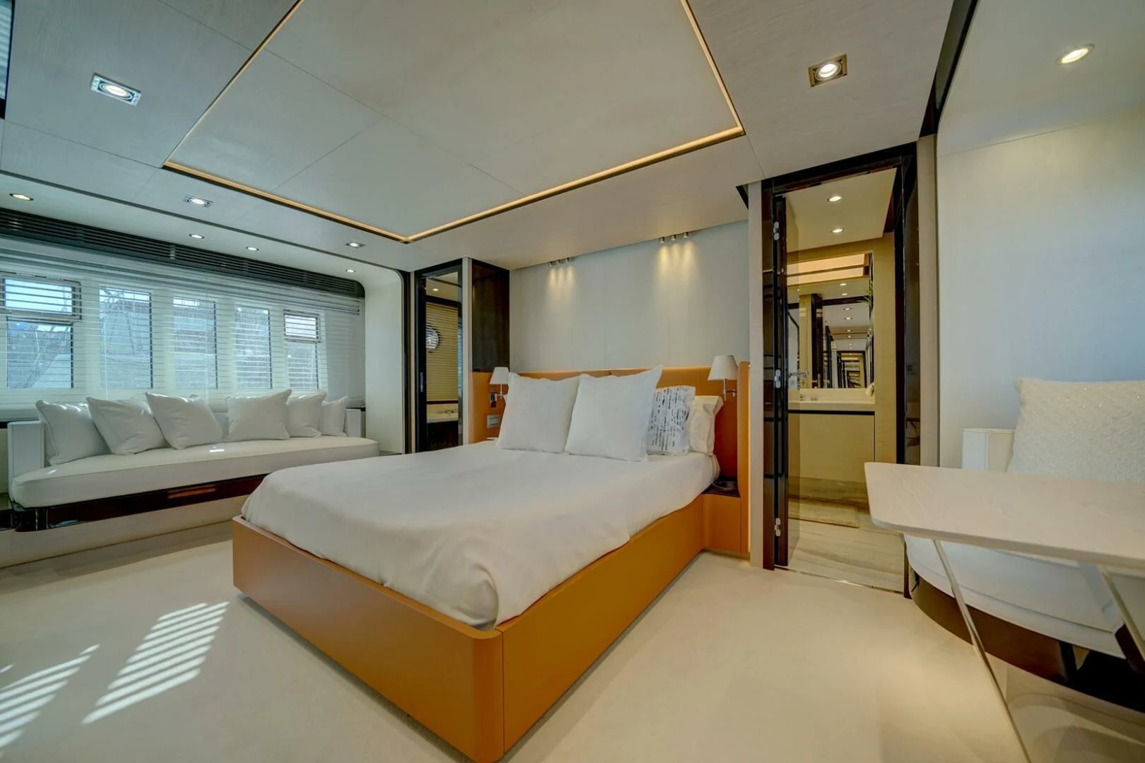 a room with a bed and a couch aboard 80 AZIMUT Yacht for Sale