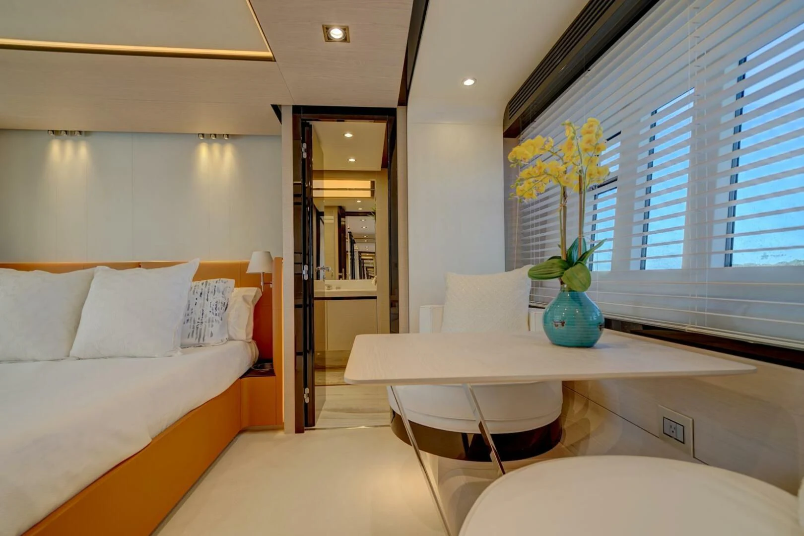 a bedroom with a bed and a desk aboard 80 AZIMUT Yacht for Sale