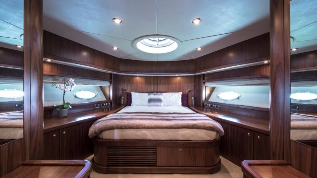 a bed in a room aboard INFINITO Yacht for Sale