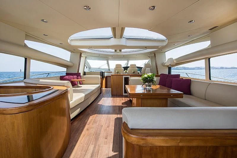 a living room with a large window aboard INFINITO Yacht for Sale