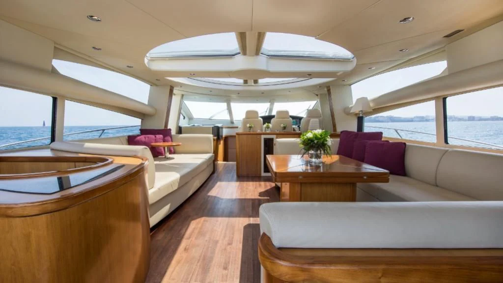 a living room with a large window aboard INFINITO Yacht for Sale
