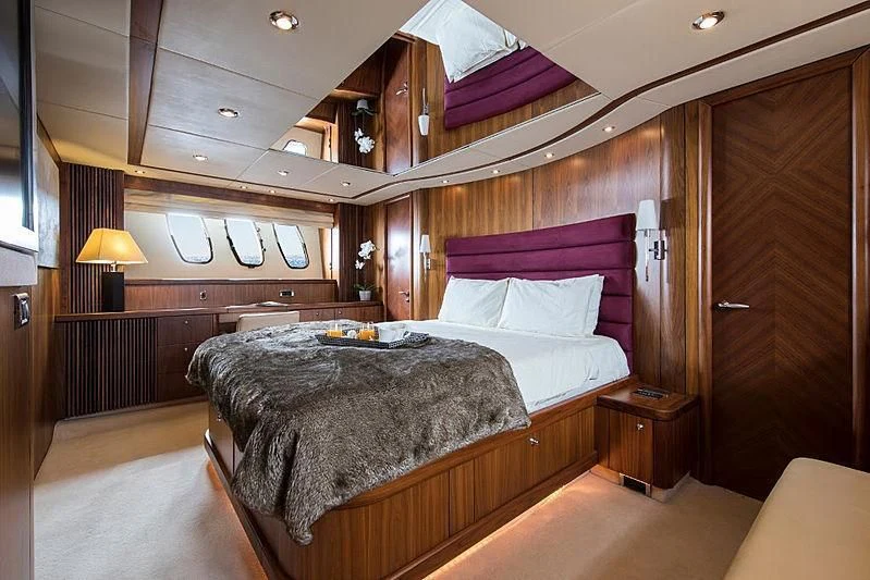 a bed in a room aboard INFINITO Yacht for Sale