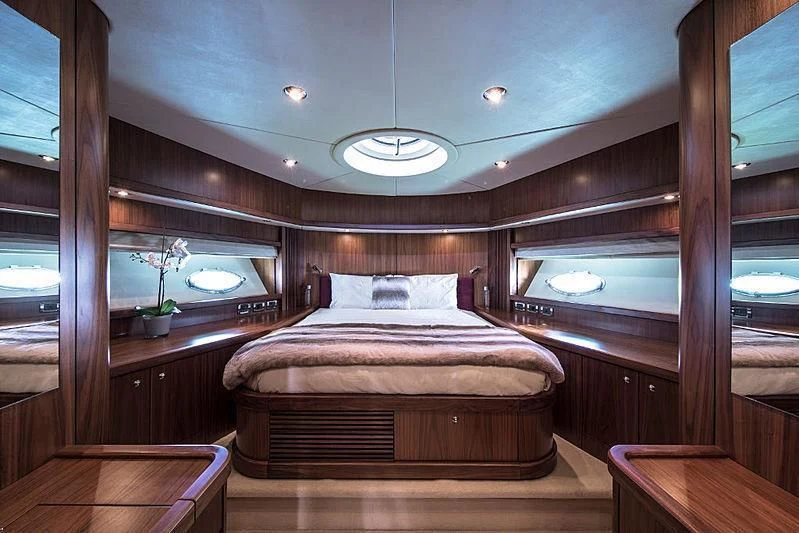 a bed in a room aboard INFINITO Yacht for Sale