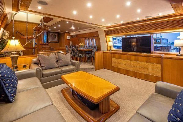 a living room with a large television aboard APOLLO Yacht for Sale