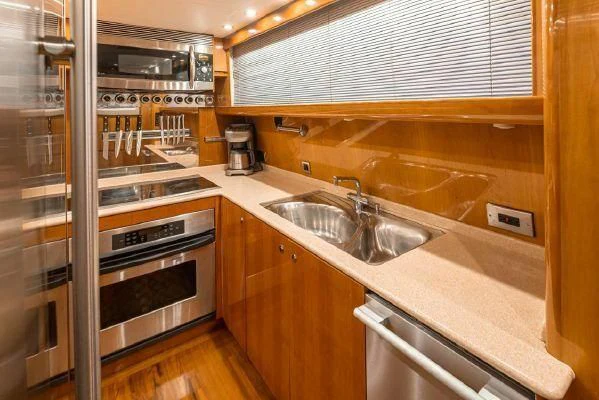 a kitchen with stainless steel appliances aboard APOLLO Yacht for Sale