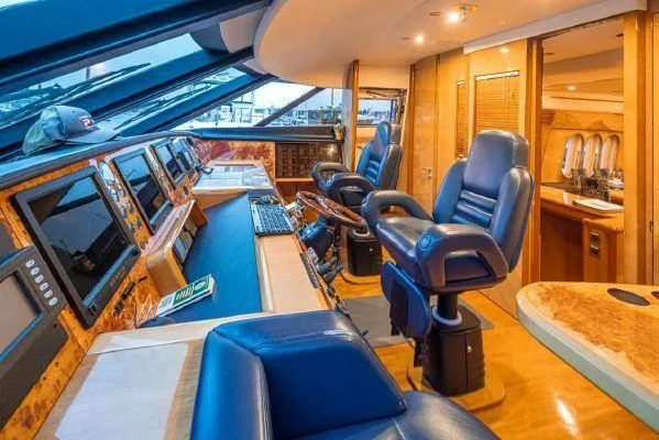 a room with a desk and chairs aboard APOLLO Yacht for Sale
