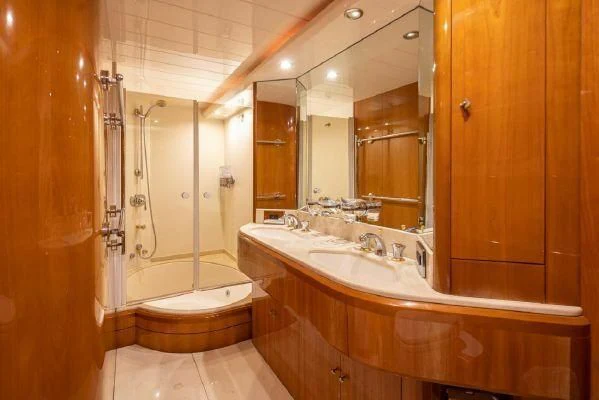 a bathroom with a large mirror aboard APOLLO Yacht for Sale