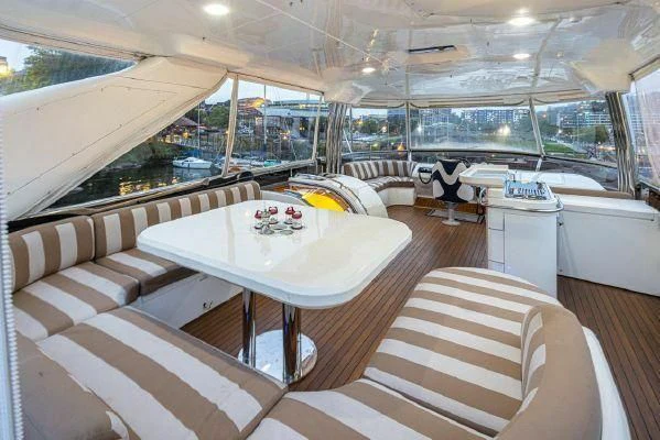 a room with a table and chairs aboard APOLLO Yacht for Sale