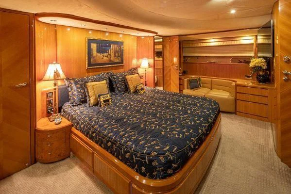 a large bed in a hotel room aboard APOLLO Yacht for Sale