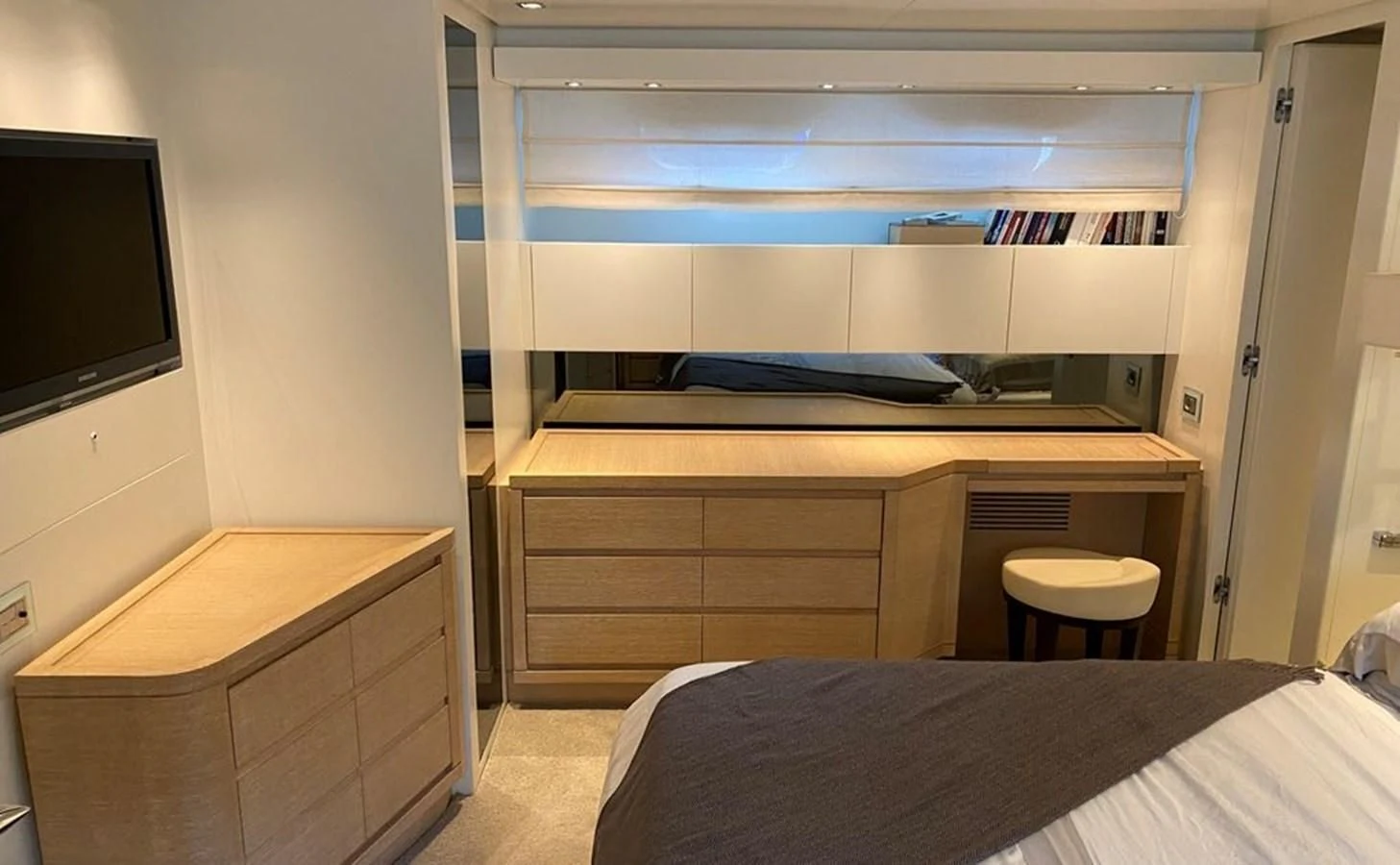 a room with a bed and a tv aboard ACCI Yacht for Sale