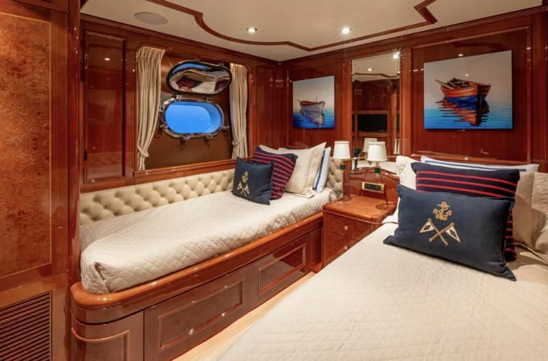 a room with a bed and a mirror aboard FELICITA Yacht for Sale