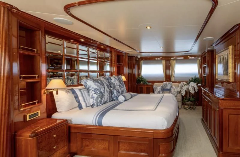 a bedroom with a bed and a desk aboard FELICITA Yacht for Sale