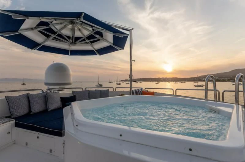 a boat with a chair and a table on it aboard FELICITA Yacht for Sale