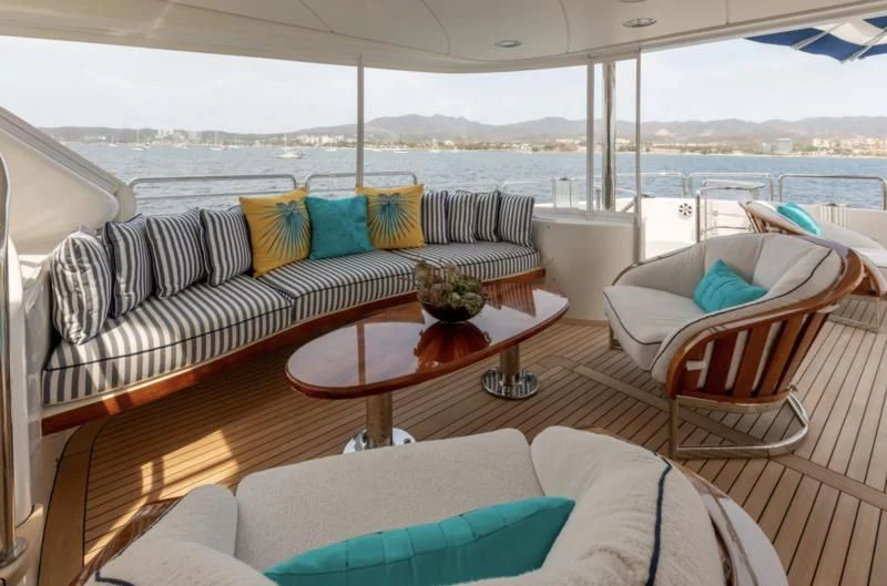 a living room with a couch and a table aboard FELICITA Yacht for Sale